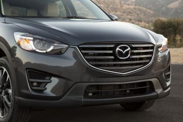 Mazda рассекретила модернизированный седан Axela (ФОТО)