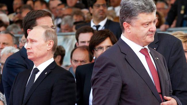 Меркель и Макрон призвали Порошенко и Путина найти компромисс